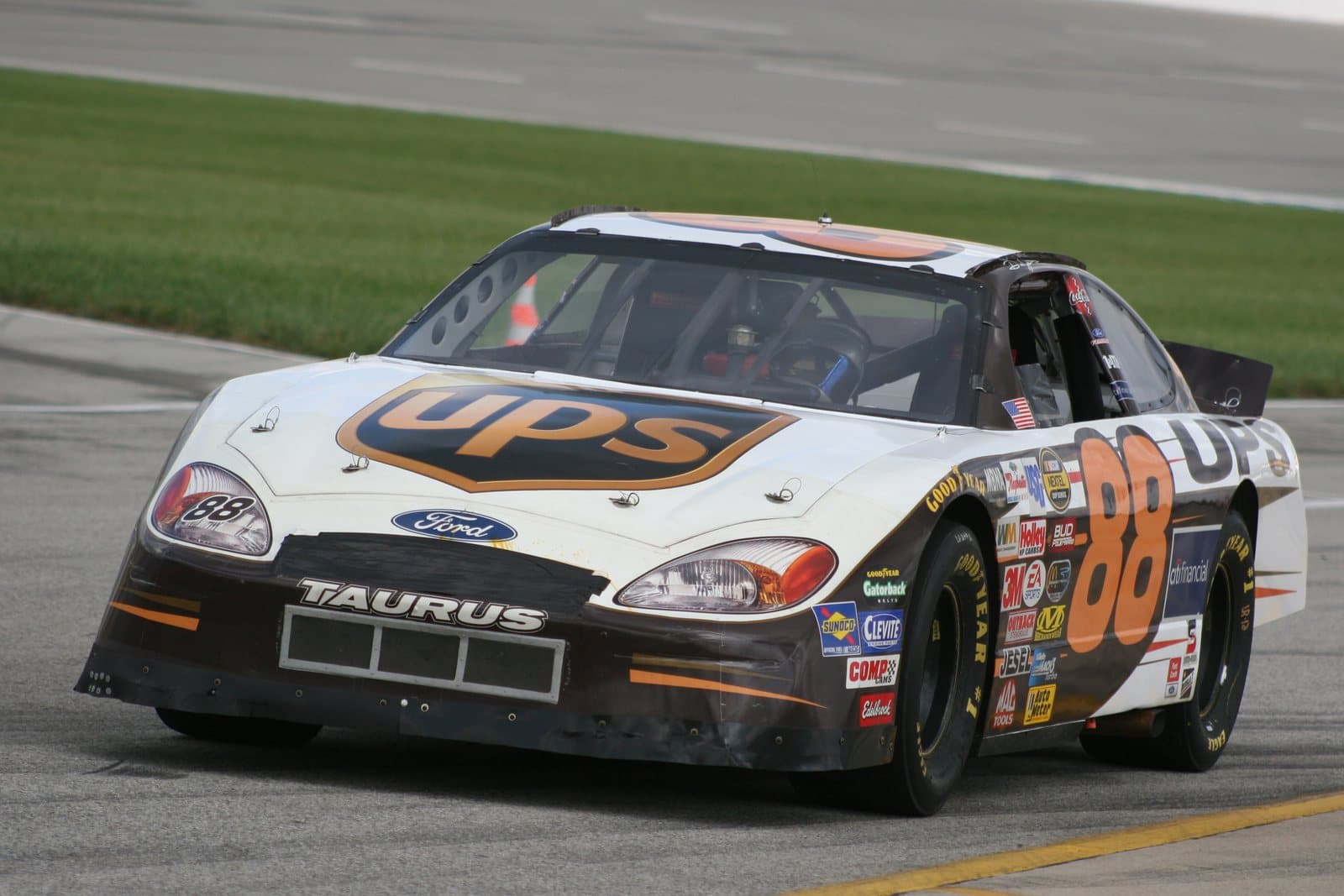A stock car speeding along a racetrack